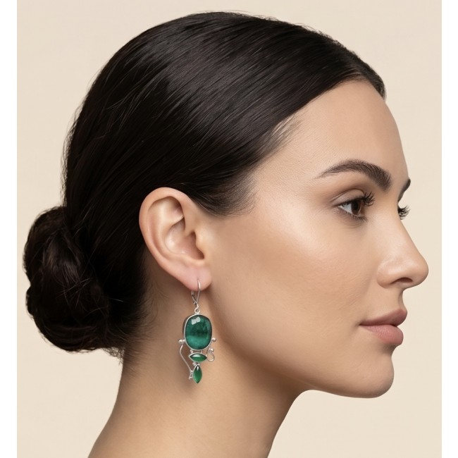 Born to Glam authentic 20.2 carat Colombian Emerald .925 Sterling Silver handcrafted earrings - Side view of woman wearing emerald dangle earring.