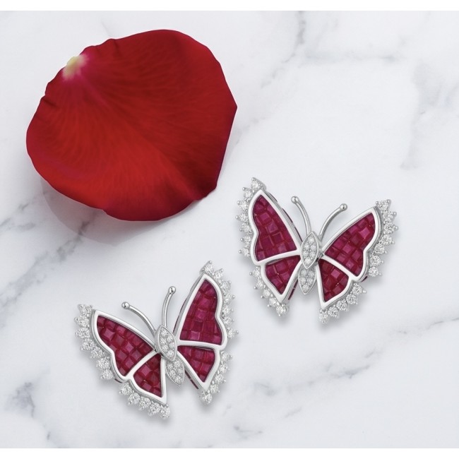 Real Beauty natural 11.9 carat mystery setting Ruby Butterflies .925 Sterling Silver handcrafted earrings - Butterfly ruby earrings with diamond accents on marble background.