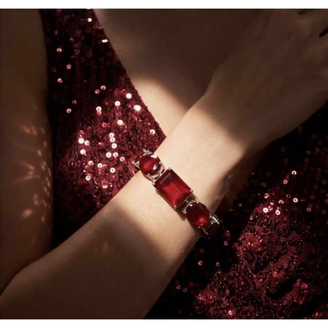 Bella Rosa - Magnificent 152.4 carat authentic Ruby .925 Sterling Silver handcrafted Bracelet - Worn on wrist, ruby bracelet, red sequin dress backdrop.