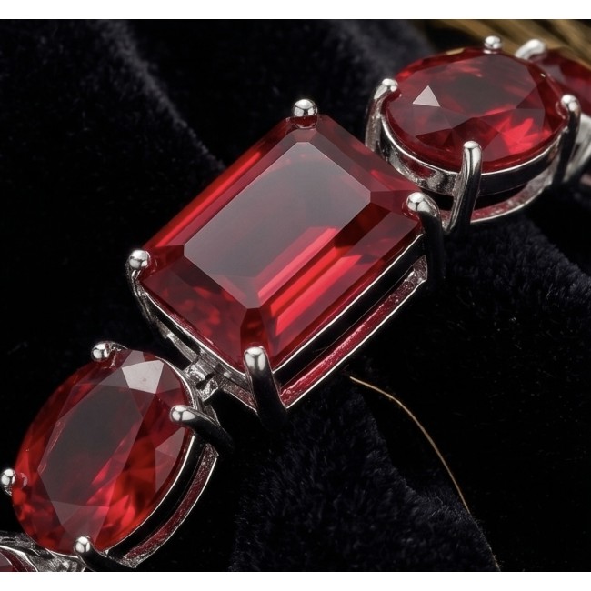 Bella Rosa - Magnificent 152.4 carat authentic Ruby .925 Sterling Silver handcrafted Bracelet - Ruby stone close-up on jewelry setting with silver prongs.