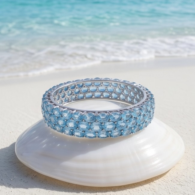 Serenity - Spectacular authentic 145.5 carat Swiss Blue Topaz .925 Sterling Silver handmade bangle Bracelet - Serenity bracelet with Swiss Blue Topaz on seashell by the beach.