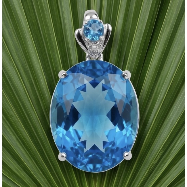 Paradise Found - Vintage style 26.8 carat Swiss Blue Topaz .925 Sterling Silver DIPPED IN RHODIUM handmade Pendant - Close-up of vintage style Swiss Blue Topaz pendant on leafy background.