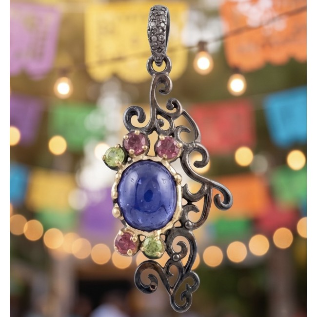 Summer Fiesta 9.5 carat natural Tanzanite black rhodium over .925 Sterling Silver Handcrafted Pendant - Close-up of Summer Fiesta Tanzanite pendant with decorative background