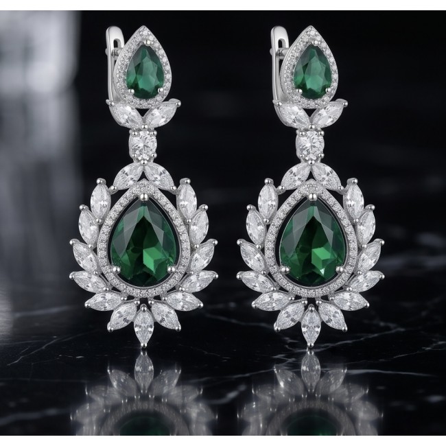 Magnificent Jewel 17.5 carat Emerald 14K white Gold over .925 Sterling Silver handcrafted earrings - Elegant drop earrings with emerald and diamond accents on black background.