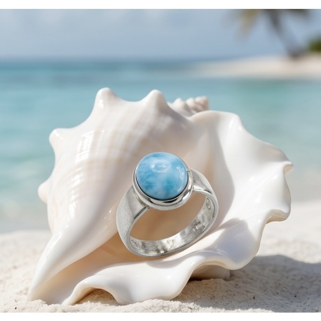 7.9 carat Blue Perfection natural Larimar .925 Sterling Silver handmade ring size 7 1/4 - Larimar ring on shell, beach background, stone close-up.