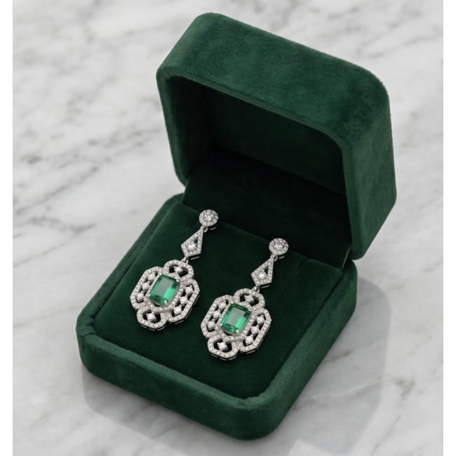 Magnificent Jewel 17.5 carat Emerald 14K white Gold over .925 Sterling Silver handcrafted earrings - Emerald earrings in open green box on marble background