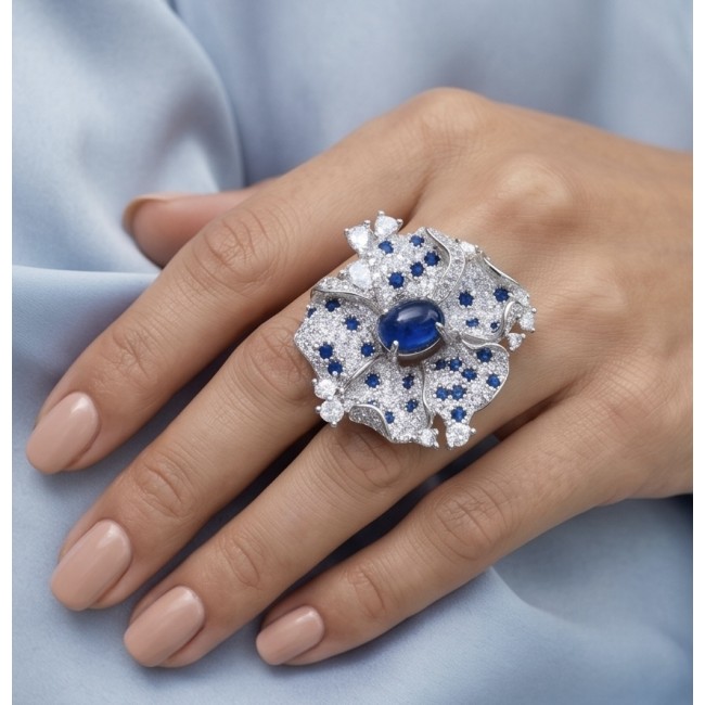 Blue Flower 12.2 carat natural Sapphire .925 Sterling Silver Perfectly handcrafted Ring s. 7 1/4 - Elegant sapphire flower ring worn on hand, showcasing intricate details.