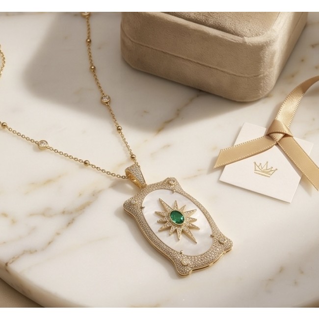 Precious Blister Pearl 2.4 carat Emerald 18K Gold over .925 Sterling Silver .925 Sterling Silver Necklace; 24 inches long - Gold necklace with emerald and pearl, top view on marble surface.