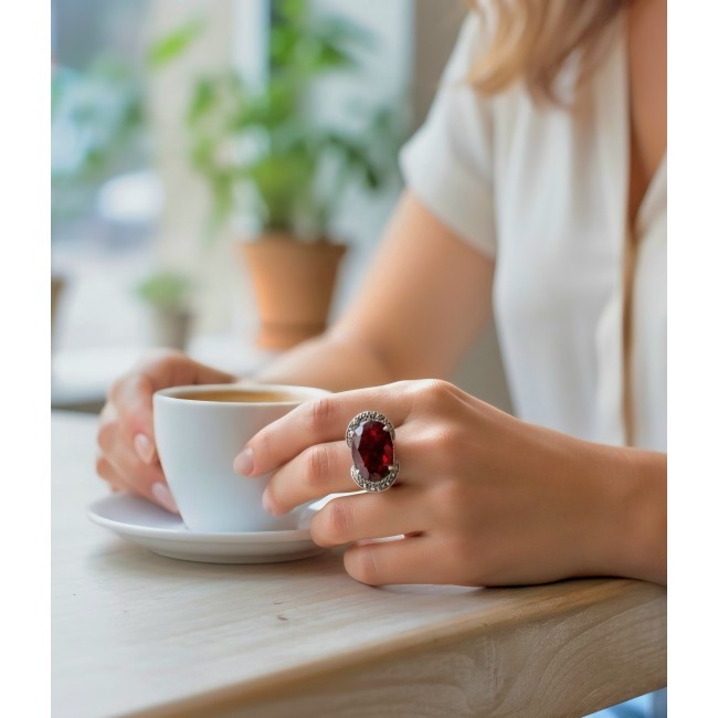 Red Power Authentic 25.4 carat Garnet .925 Sterling Silver brilliantly handcrafted large Statement Ring size 7 - Garnet ring worn on hand holding coffee, close-up view.