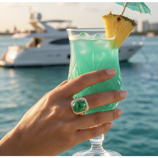 Translucent Imperial Green Jadeite of Unmatched Quality .925 Sterling Silver dipped in 22K Gold handmade Cocktail Ring s. 7 - Worn on hand holding drink, yacht in background, showcasing jadeite ring.