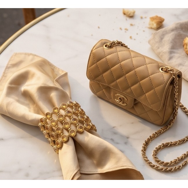 Enchanted Beauty 39.5 carat authentic Brazilian Citrine 18K Gold over .925 Sterling Silver handcrafted Bracelet - Gold napkin ring with Citrine, placed next to a quilted handbag.
