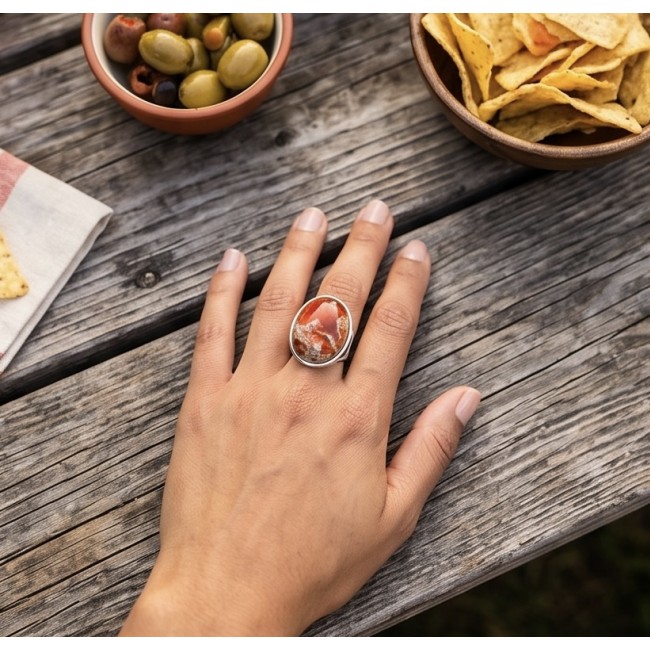 Queen of Fire best quality 22.4 carat Mexican Opal RHODIUM over .925 Sterling Silver handmade ring 5 - Mexican Opal ring worn on hand, with snacks in the background.