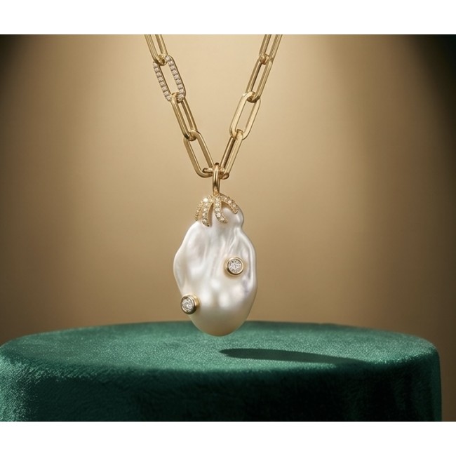 Precious Mother of Pearl 18K Gold over .925 Sterling Silver .925 Sterling Silver Necklace; 16 inches long - Front view of pearl pendant necklace on a green stand.