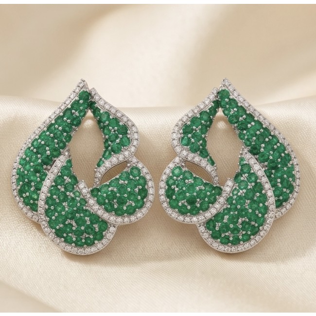 Royalty 7.9 carat authentic pave Colombian Emerald .925 Sterling Silver dipped in Rhodium Handcrafted Statement Earrings - Close-up of Royalty 7.9 carat Colombian Emerald earrings on satin.