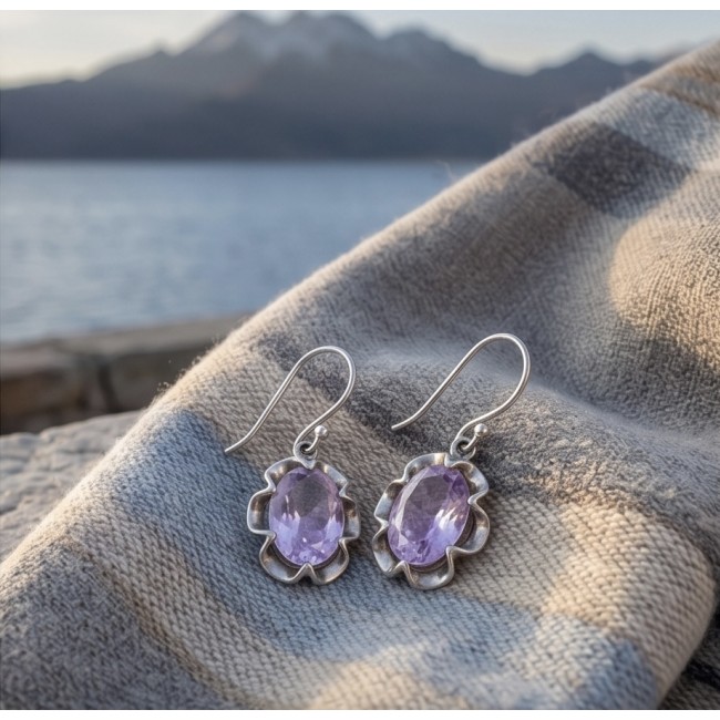 Norwegian Pink Fiord Quartz .925 Sterling Silver earrings - Side view of pink quartz sterling silver earrings on fabric.
