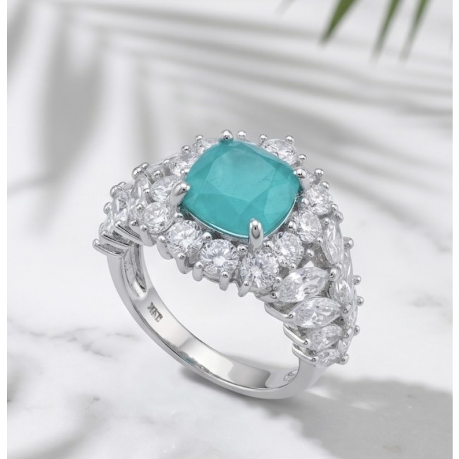 5.4 carat natural Colombian Emerald 8.9 carat Moissanite .925 Sterling Silver handmade Statement Ring size 7 1/2 - Emerald ring with moissanite stones on marble background, angled view