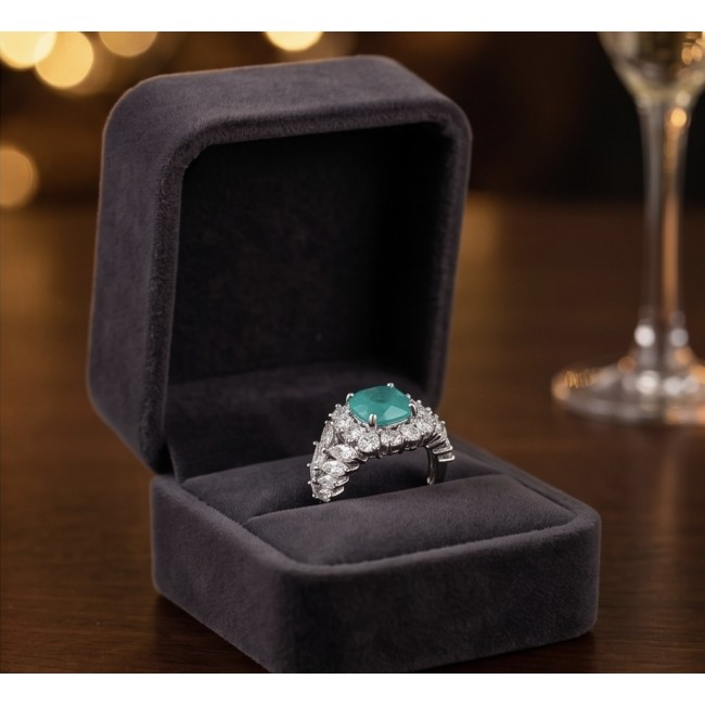 5.4 carat natural Colombian Emerald 8.9 carat Moissanite .925 Sterling Silver handmade Statement Ring size 7 1/2 - Emerald and moissanite ring in open box, front view on table.