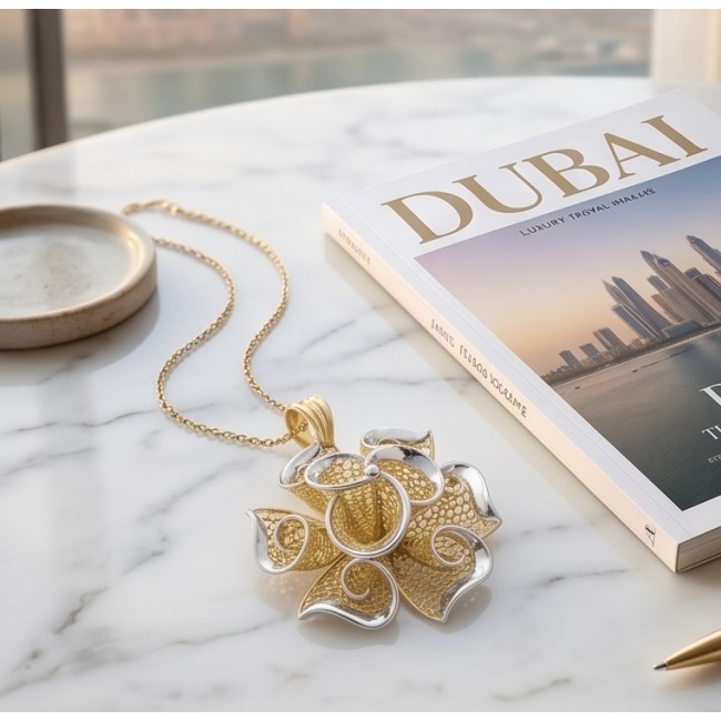 Dubai Style - Golden Rose .925 Sterling Silver dipped in 22K Gold handmade Pendant - Golden rose pendant on marble surface with Dubai magazine, top view.