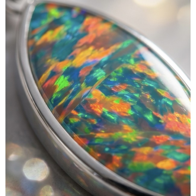 Kaleidopscop 21.5 carat Australian Doublet Opal .925 Sterling Silver handcrafted pendant - Stone close-up of Kaleidoscope 21.5 carat Australian Doublet Opal in silver.