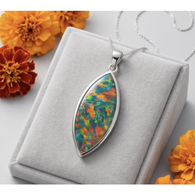 Kaleidopscop 21.5 carat Australian Doublet Opal .925 Sterling Silver handcrafted pendant - Opal pendant on box with marigolds; front view.