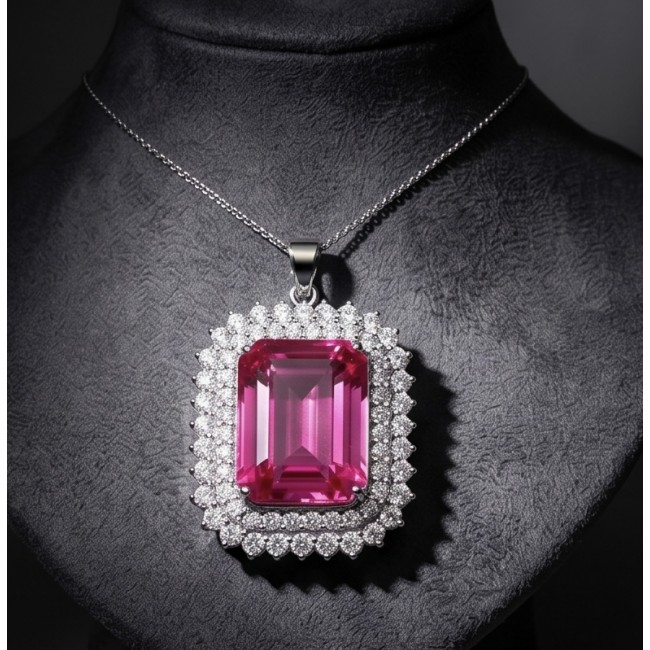 Pink Legacy Luxurious baquette cut 45.8 carat Fuchsia Pink Sapphire .925 Sterling Silver handcrafted Statement pendant - Front view of pink baquette-cut pendant with diamond halo on display.