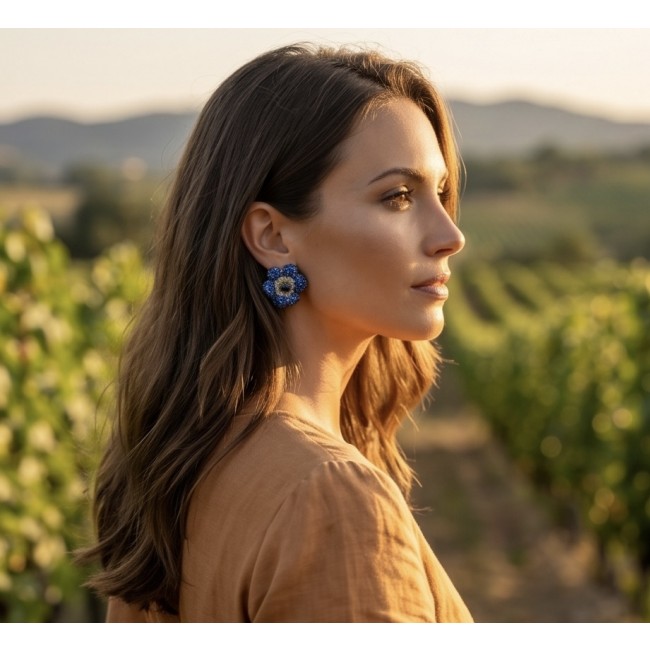 Blooming Lilis - 38.8 carat pave Sapphire from Madagascar .925 Sterling Silver handmade Statement Earrings - Side view of blue sapphire earrings worn in a vineyard setting.