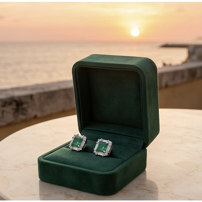 Art deco - princess cut 6.5 carat Emerald .925 Sterling Silver Handcrafted Earrings - Art deco emerald earrings in velvet box at sunset, front view.