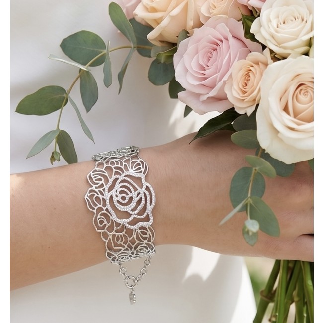Dolce Vita - Precious Natural 12.5 carat White Topaz rhodium over .925 Sterling Silver handcrafted bracelet - Rose-design bracelet with white topaz, worn on hand holding flowers.