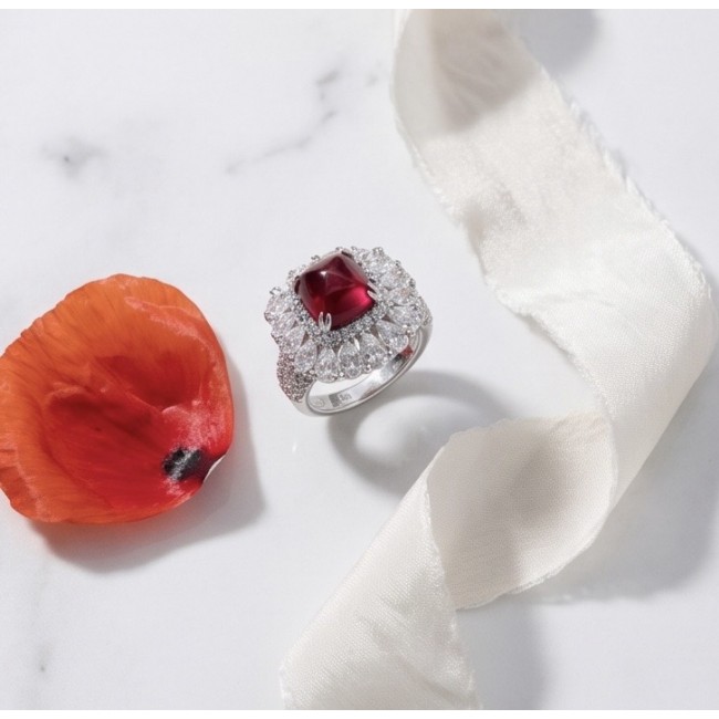 Bella Rossa Magnificent Jewel 6.4 carat Ruby .925 Sterling Silver handcrafted incredible ring s. 7 - Ruby ring with diamond setting on white ribbon and red petal, top view.