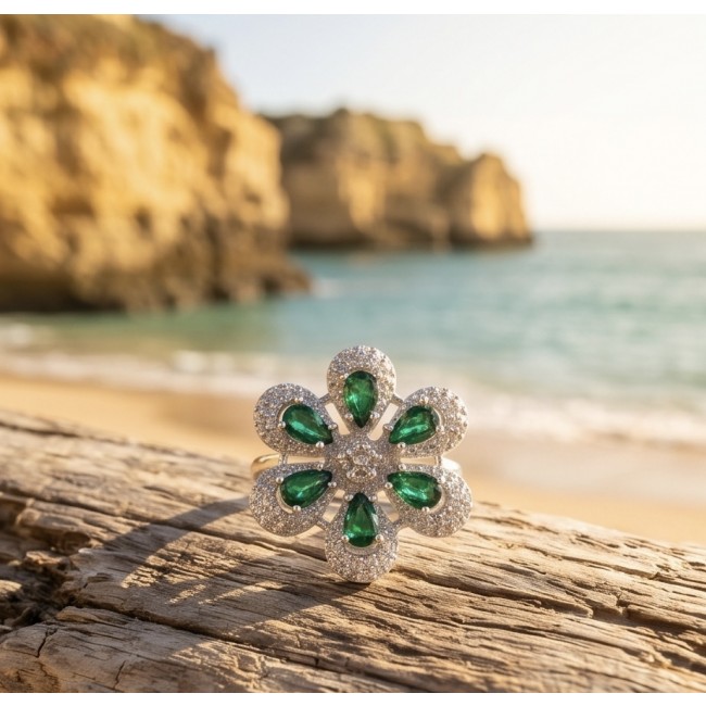 Giovanna - Authentic 10.9 carat Colombian Emerlad .925 Sterling Silver Silver dipped in Rhodium handcrafted Ring size 8 - Close-up of floral emerald ring on driftwood by the beach
