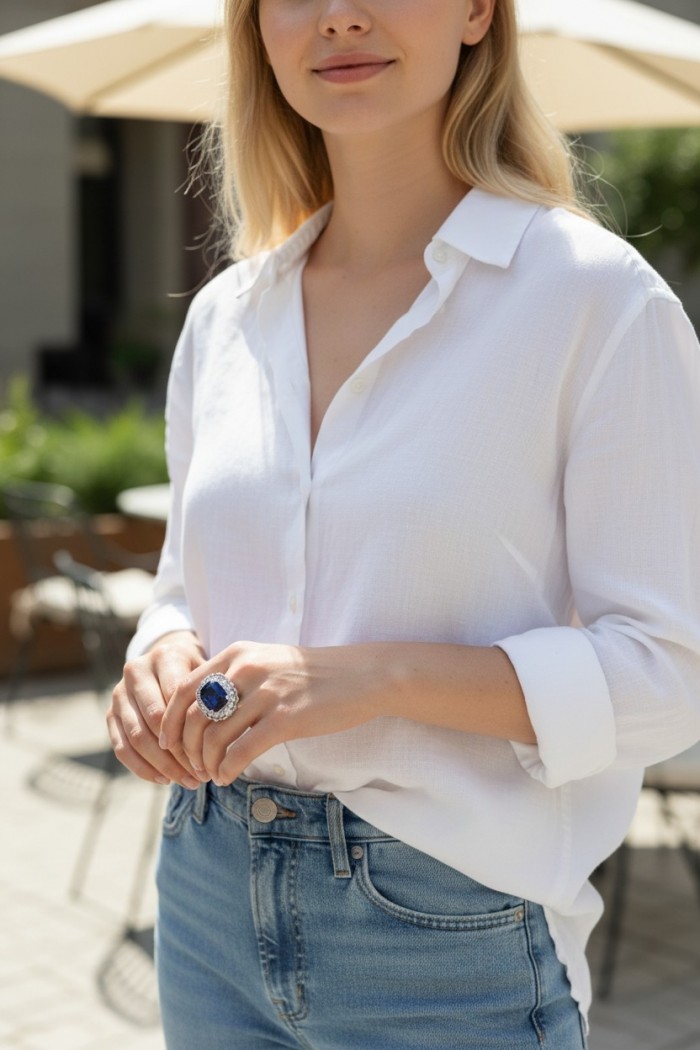 Precious Design oval cut 22.9 CARAT Tanzanite rhodium over .925 Sterling Silver Statement Ring s. 6 3/4 - Woman wearing oval cut tanzanite ring, front view