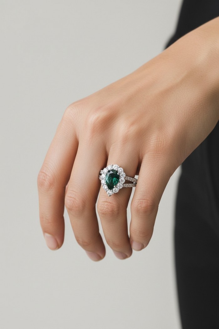 Estelle - Authentic 2.9 carat COLOMBIAN EMERALD rhodium over .925 Sterling Silver handcrafted Ring size 7 - Emerald ring with halo setting, worn on hand, showcasing side profile.