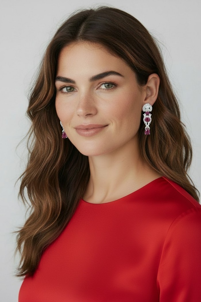 Leo - the King - Genuine 6.8 carat Ruby rhodium over .925 Sterling Silver handcrafted Statement Earrings - Woman wearing Leo earrings, side view, showcasing rubies and silver detail.