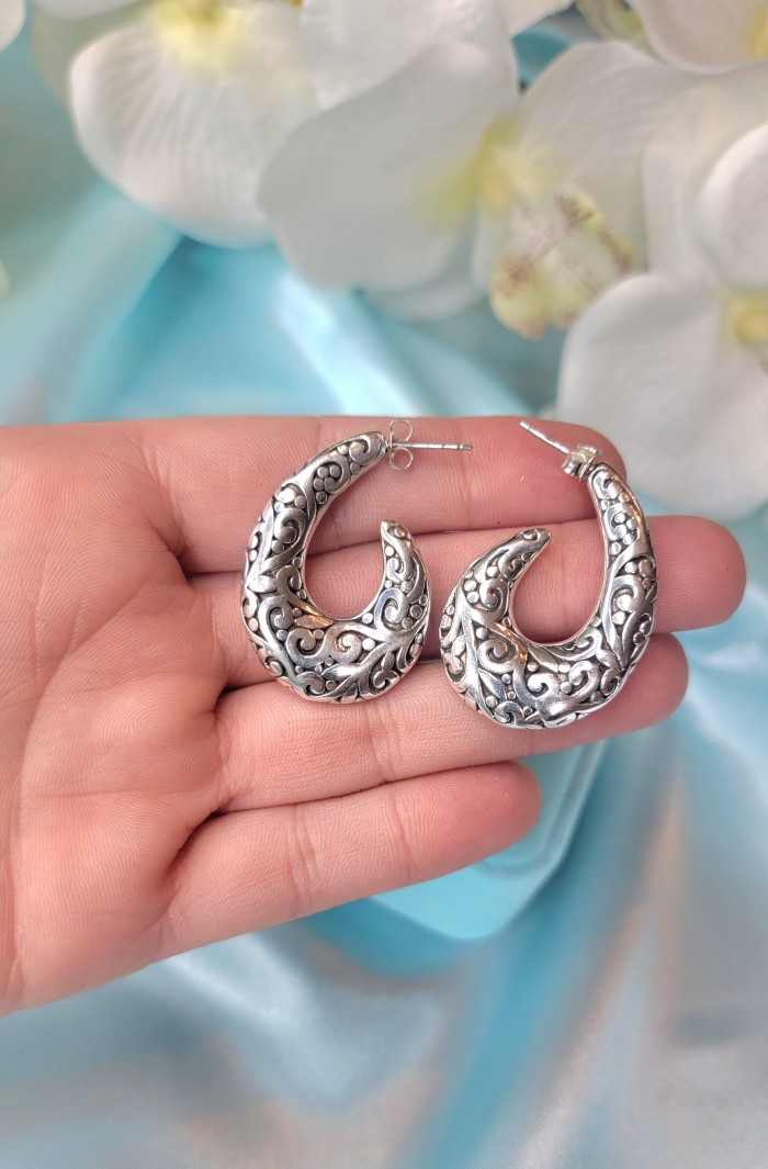 1 5/8 inches long - Free Spirit bohemian Style .925 Sterling Silver handmade Bali made Oversized Earrings - Bohemian style .925 sterling silver earrings held on hand close-up.