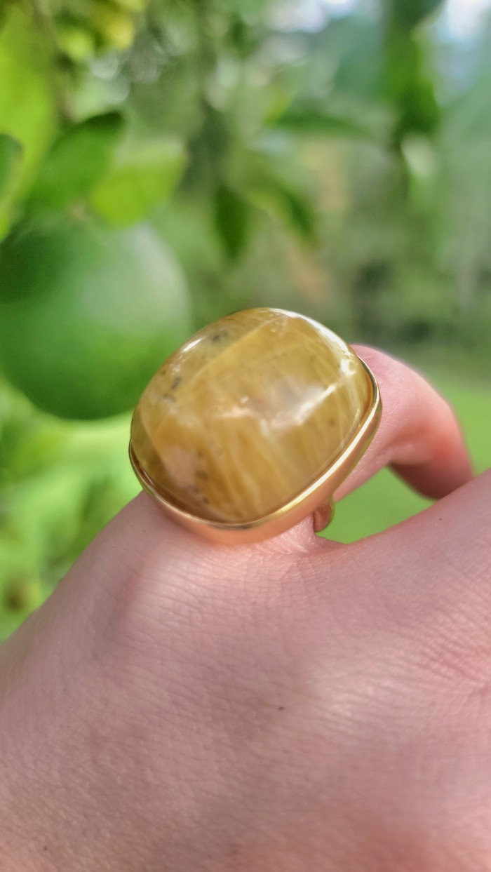 Himalayan Treasure 29.9 carat Best quality Golden Rutilated Quartz 18K Gold over .925 Sterling Silver handcrafted Ring Size 4 1/4 - Golden Rutilated stone close-up, worn on hand.