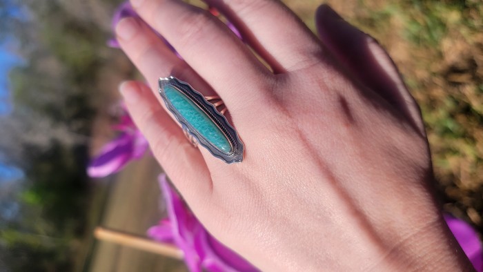 Rare authentic Turquoise .925 Sterling Silver handcrafted Large ring; s. 9 - Turquoise sterling silver ring worn on hand, outdoor background.