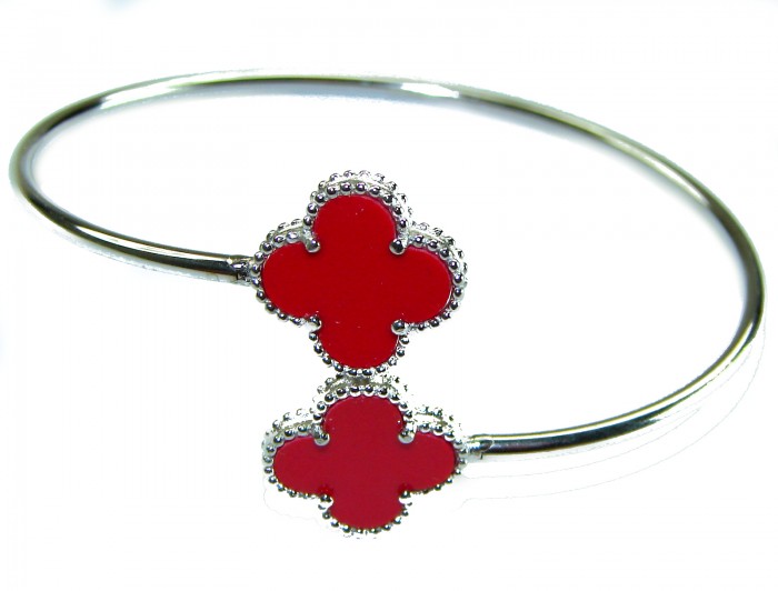 A Red four-leaf clover Coral .925 Sterling Silver handcrafted Bracelet - Silver bracelet with red clover motifs, top view.