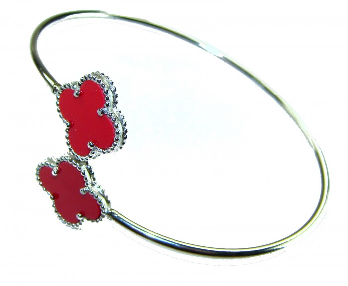 A Red four-leaf clover Coral .925 Sterling Silver handcrafted Bracelet - Bangle with red clover details in sterling silver, side view.