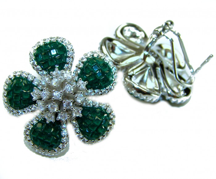 Born to Glam authentic 24.4 carat Colombian Emerald .925 Sterling Silver handcrafted Statement earrings - Flower-shaped emerald earrings, stone close-up, white background.