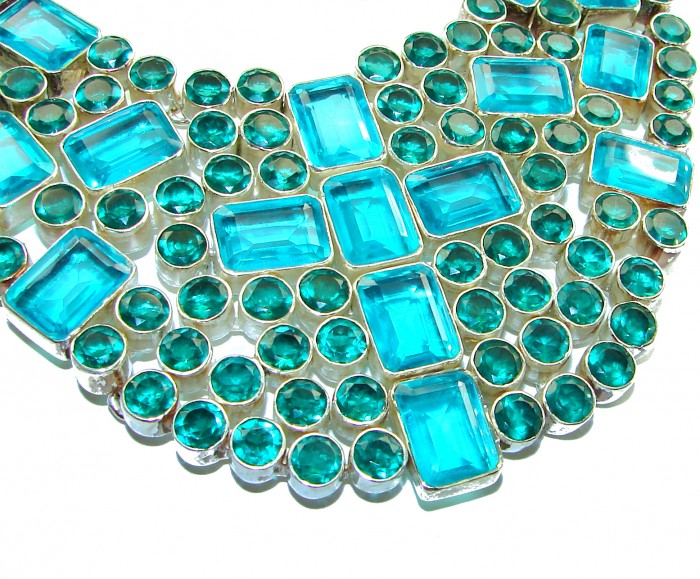 Lavishly Abundant - Holy Cross 165.5 grams lab. Paraiba Tourmaline .925 Sterling Silver handcrafted necklace - Close-up of "Lavishly Abundant" cross necklace with blue gems.