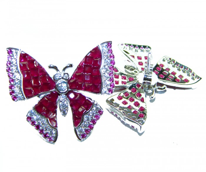 Real Beauty natural 18.2 carat Ruby Butterflies .925 Sterling Silver handcrafted earrings - Butterfly brooches close-up with ruby stones and sterling silver setting.