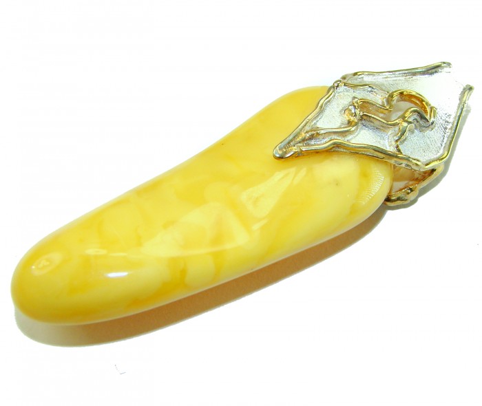 Sea Treasure Prehistoric Authentic Butterscotch Baltic Amber 2 tones .925 Sterling Silver beautifully handcrafted Huge Pendant - Butterscotch Baltic Amber with silver detail, top view.