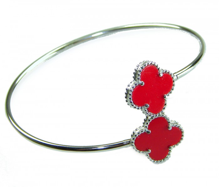 A Red four-leaf clover Coral .925 Sterling Silver handcrafted Bracelet - Silver bracelet with red clover coral, angled view.