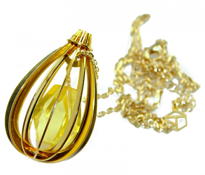 Wonderland Elegant Genuine Baltic Amber 22K Gold over .925 Silver handcrafted Necklace - Elegant Baltic Amber pendant with gold cage design and chain, close-up.