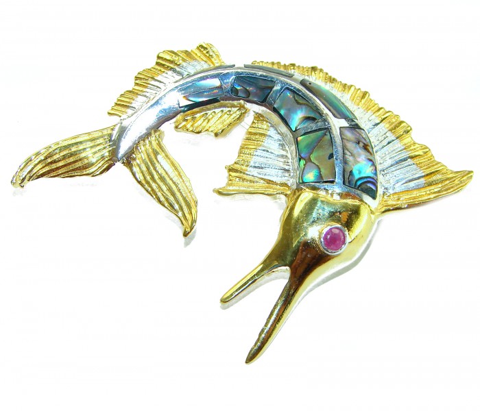 Precious Fish Natural Rainbow Abalone Ruby 14K Gold over .925 Sterling Silver handmade Pendant Brooch - Angled view of fish brooch with abalone inlay and ruby eye, gold accents.