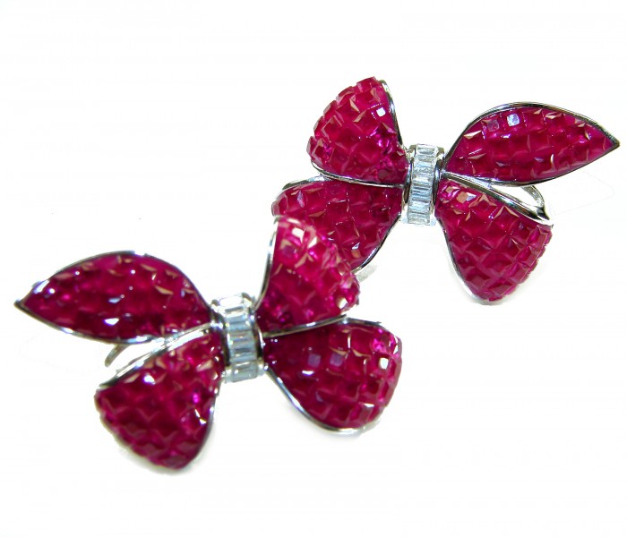 Magnificent Jewel - Bow 25.5 carat Ruby .925 Sterling Silver handcrafted incredible earrings - Close-up of ruby bow earrings in .925 sterling silver