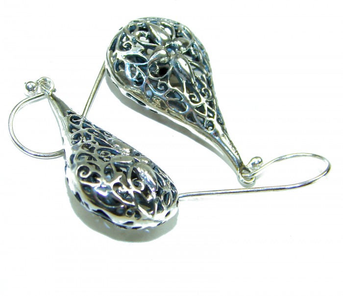 Free Spirit- bohemian Style .925 Sterling Silver handmade Bali made Oversized Earrings - Silver earrings, bohemian style, intricate design, side view.