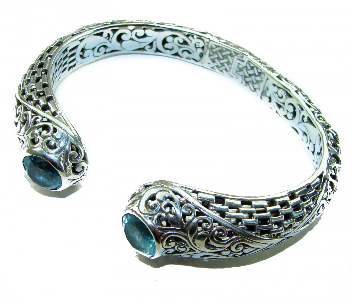 Large and Heavy Bali Legacy 45.5 grams authentic 10.9 carat Swiss Blue topaz Floral Bracelet in .925 Sterling Silver handcrafted - Top view of ornate silver bracelet with blue stones at ends