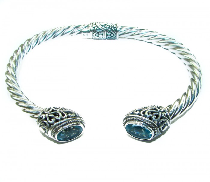 BLUE DREAMER 8.5 carat authentic Swiss Blue Topaz Floral Bracelet in .925 Sterling Silver - Silver bracelet with blue topaz, top view showing floral design.