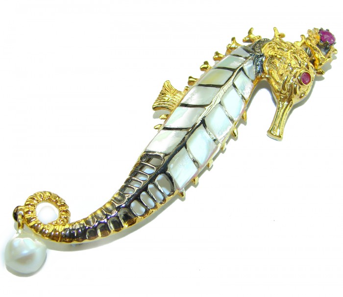 Precious SeaHorse Natural Rainbow Abalone Ruby 14K Gold over .925 Sterling Silver handmade Pendant Brooch - Side view of seahorse brooch with abalone, rubies, and gold accents.